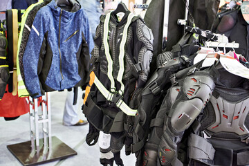 Wall Mural - Motorcyclist jackets and protective clothing in shop