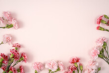 Design Concept Of Mother's Day Holiday Greeting With Carnation Bouquet On Pink Table Background