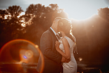 Poster - Closeup shot of just a married couple at sunset