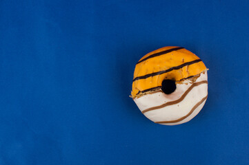 Canvas Print - Half the donut is eaten. Two halves of the donut in one. Whole donut made up of two halves