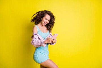 Sticker - Profile photo of pretty cheerful girl typing blog post comment toothy smile isolated on yellow color background