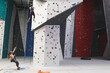 © Wavebreak Media - Two caucasian women wearing face masks using ropes to climb wall at indoor climbing gym