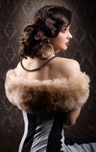 Retro Woman Portrait. Vintage Photo Of 20s Or 30s Style Woman In Furs. Old Fashionable Makeup And Finger Wave Hairstyle.