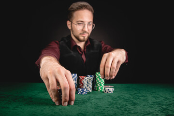 Young gentleman giving bet in poker