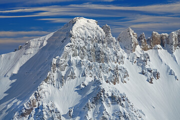 Winter landscape of the snow flocked San Juan Mountains with beautiful clouds above, Colorado, USA