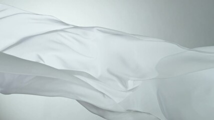 Wall Mural - White transparent silk fabric flowing by wind, super slow motion
