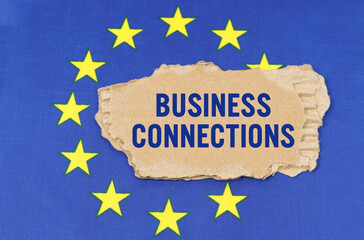 There is a cardboard box on the EU flag that says- BUSINESS CONNECTIONS