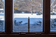 This Image Features An Abstract Texture Background Of An Ice Frosted Window With A Holiday Candlestick On Its Window Sill, Showing An Outdoor Winter Snow Landscape View.