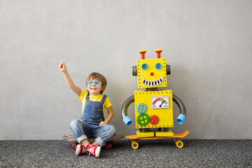 Wall Mural - Happy child with toy robot