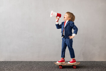 Poster - Happy child wearing suit riding vintage skateboard