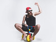 © Volodymyr - Amazed funny bicycle rider, excited man on colorful bicycle toy in sunglasses, cap. Guy riding childs tricycle.
