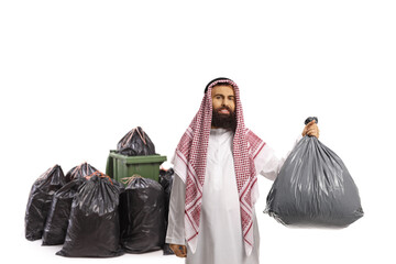 Wall Mural - Saudi arab man throwing a plastic waste bag in a bin