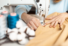 Clothing Repair. Worker In A Garment Factory, Fashionable And Sustainable Production. Fix Dress.