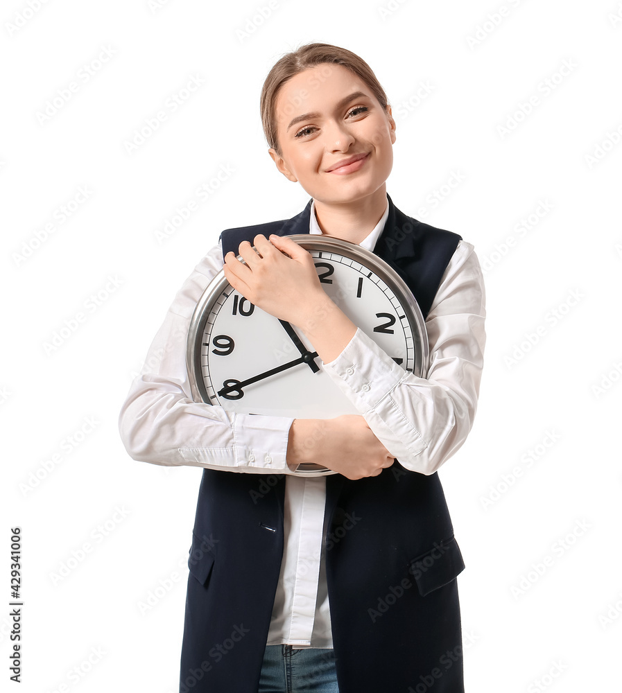 Young businesswoman with clock on white background
