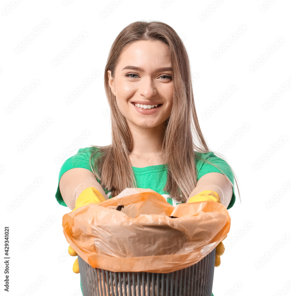 Female volunteer with trash bin on white background