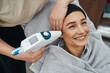 Female patient skin being treated with a CO2 mesotherapy gun