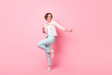 Sticker - Full size photo of young pretty happy excited crazy smiling girl dancing enjoying weekend isolated on pink color background