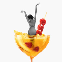 Contemporary Art Collage, Modern Design. Summer Mood. Tender Ballerina Sitting On Giant Cocktail Glass With Yellow Berry Drink