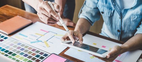 team of creative web/graphic designer planning, drawing website ux app for mobile phone application 
