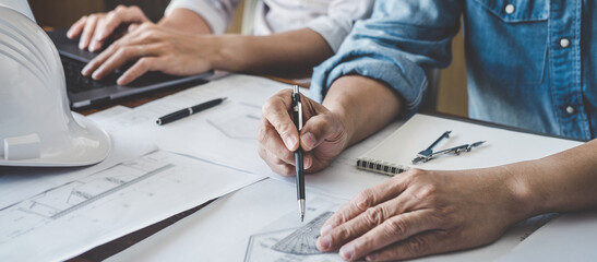 Wall Mural - construction and structure concept of engineer or architect meeting for project working with partner
