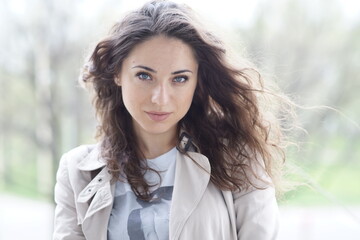 Portrait of a young beautiful girl in the park