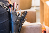 Fototapeta  - hairdresser leather belt with hairdressing tools