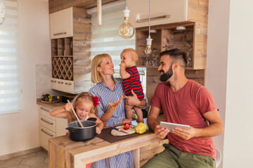 Canvas Print - Family having fun in the kitchen