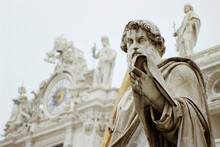 The Statue Of St. Paul In Front Of The Facade Of St. Peter's Basilica