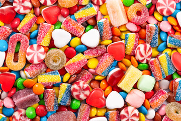 Wall Mural - Colorful chocolate dragee and different candy.