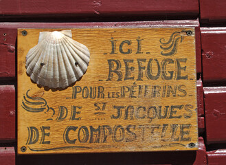 Wall Mural - Saint Jean Pied de Port, France - Shell as a symbol of the pilgrimage route to Santiago de Compostela. The Pilgrim's Road is World Heritage Site by UNESCO.