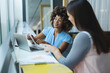 © Wavebreak Media - Diverse female business colleagues sitting at window having a meeting