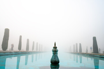 Wall Mural - Fountains of the Taj Mahal, Agra, India covered by the fog