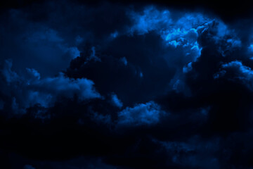 Wall Mural - dark blue sky. thunderclouds. dramatic sky background with copy space for design. web banner. epic s