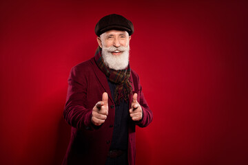 Sticker - Photo portrait of grandfather wearing vintage clothes pointing fingers at you laughing isolated vibrant red color background