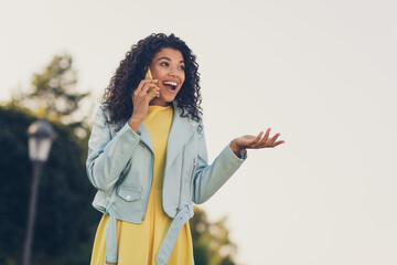 Poster - Photo of pretty excited lady hold telephone have conversation wear yellow dress jacket on street outside