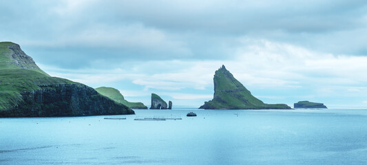 Wall Mural - Dramatic view on Drangarnir and Tindholmur sea stacks