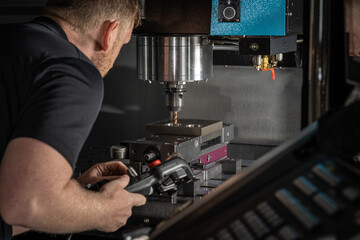 Machinist working on a cnc machine 