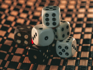 Dice isolated on black background. Playing dice