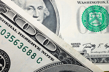 Close-up elements of a hundred dollar bill. Finance background and dollar exchange rate