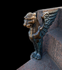 Bronze Griffin on a granite embankment in Saint-Petersburg