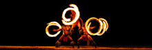 Luau Hawaiian Fire Dancers Motion Blur Tourist Attraction In Hawaii Or French Polynesia, Traditional Polynesian Dance With Men Dancer.