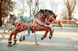 Soviet abandoned amusement park. Vintage carousel horses. A traditional fairground carousel