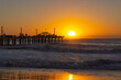 © fabianalejandro - Old pier at sunrise. Beach without people.