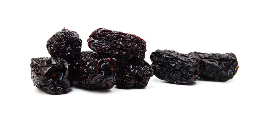 Black dried jujube on white background.