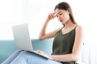 © Timeimage - Asian woman is using laptop with worried expression