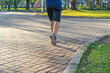 © Quang - Human legs jogging in the park in sunny day