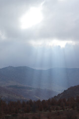 Poster - Sunlight Beams on Mountain. Beautiful mountain landscape background.