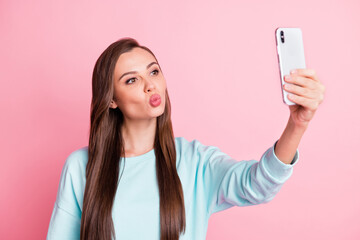 Poster - Photo of beautiful flirty young woman take photo selfie send air kiss isolated on pastel pink color background