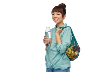 Sticker - sustainability, eco living and people concept - portrait of happy smiling young asian woman with green reusable string bag for food shopping and glass bottle of water over white background