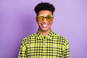 Poster - Portrait of attractive funny cheerful brunet guy wearing dollar sign specs isolated over violet purple color background